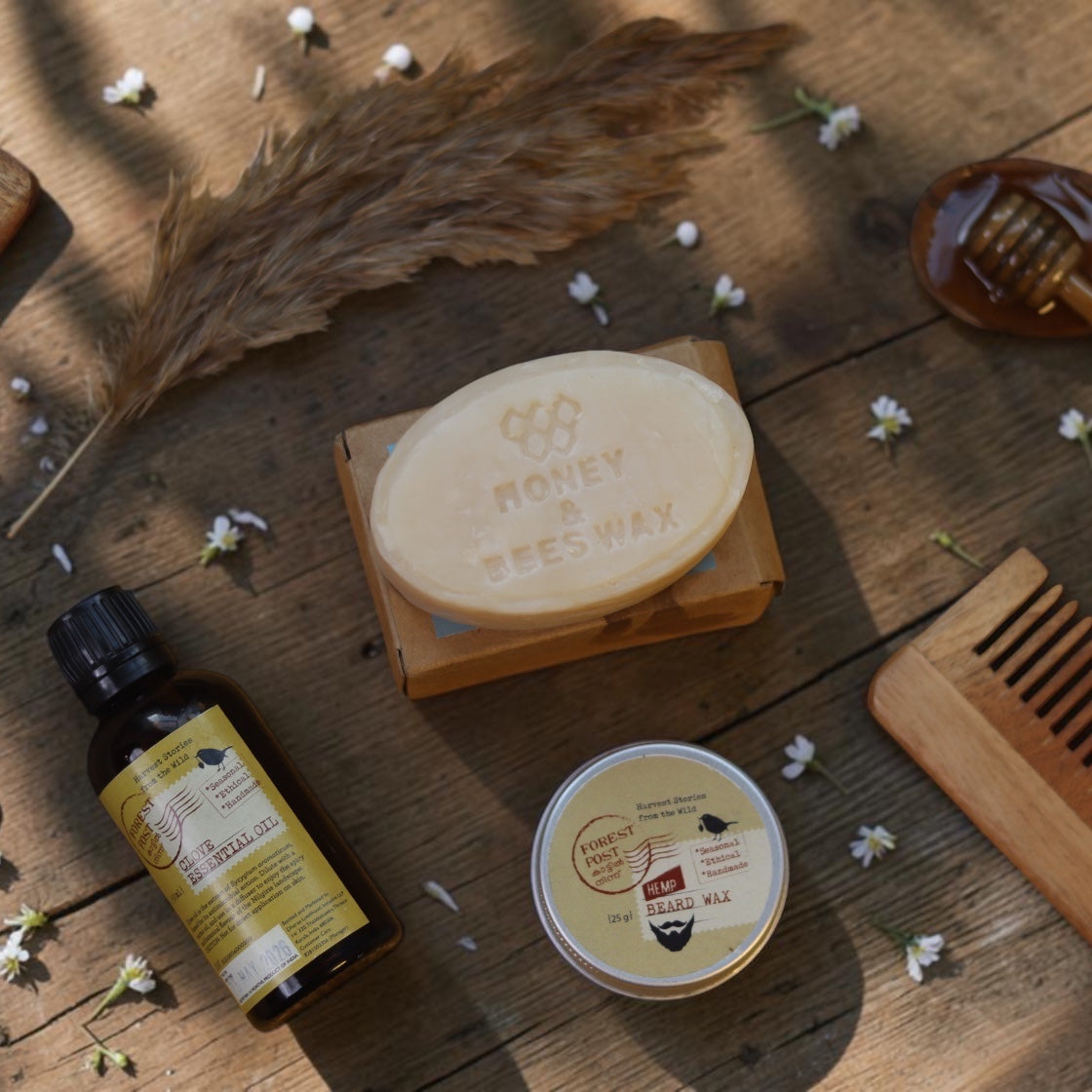 purepicked handmade soap bar with honey and beeswax, essential oil, and beard wax on a rustic wooden surface