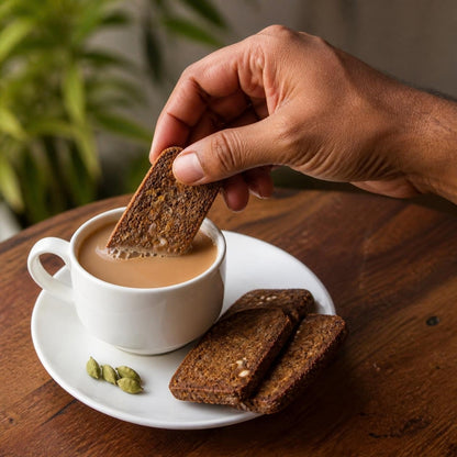 Ragi Millet Rusk by Early Foods dipped in a cup of tea