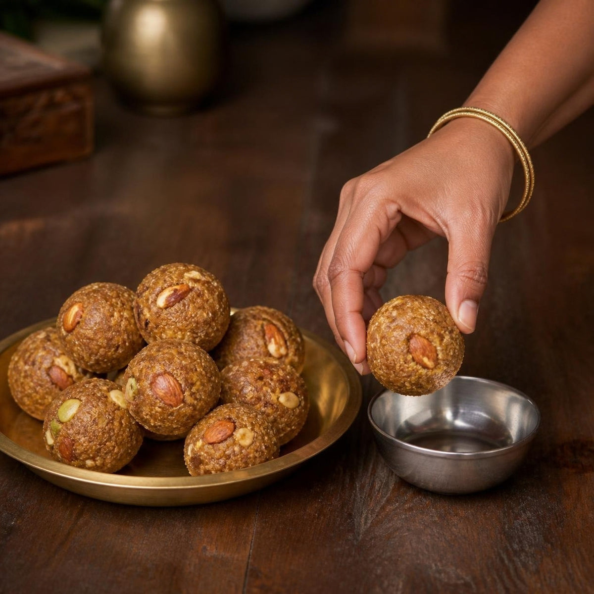Gond & Dry Fruits A2 Ghee Laddoo by Early Foods on a brass plate