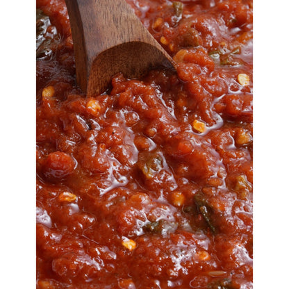 Close-up texture of Spicy Arrabbiata sauce with a wooden spoon
