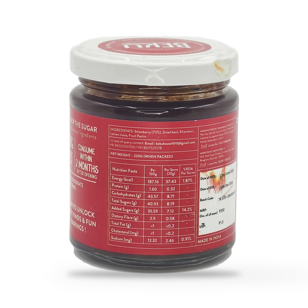 Back label of the Beku Strawberry Basil fruit spread jar, on a plain white studio background