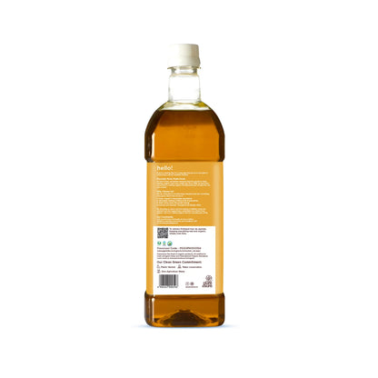 Back of the Pure & Sure cold-pressed mustard oil bottle showing the brand information panel, certification marks and barcode