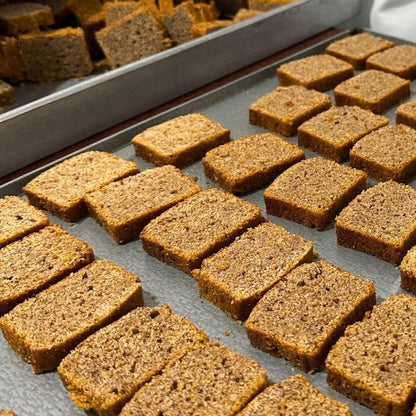 Early Foods millet rusks laid out on a baking tray after the second bake
