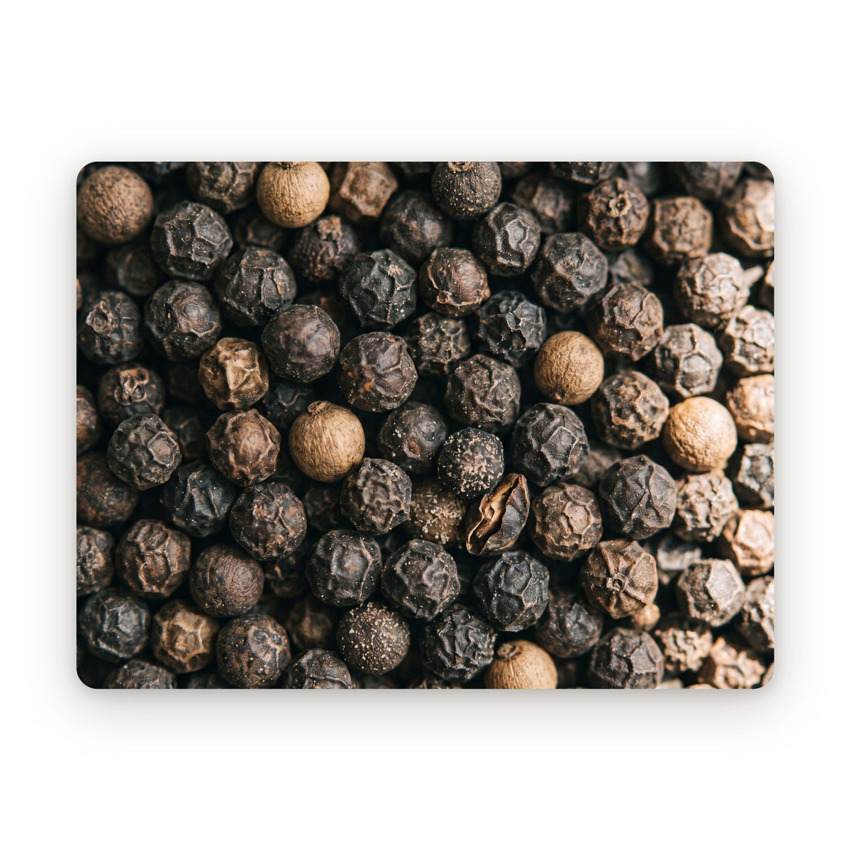 Whole black peppercorns, close up