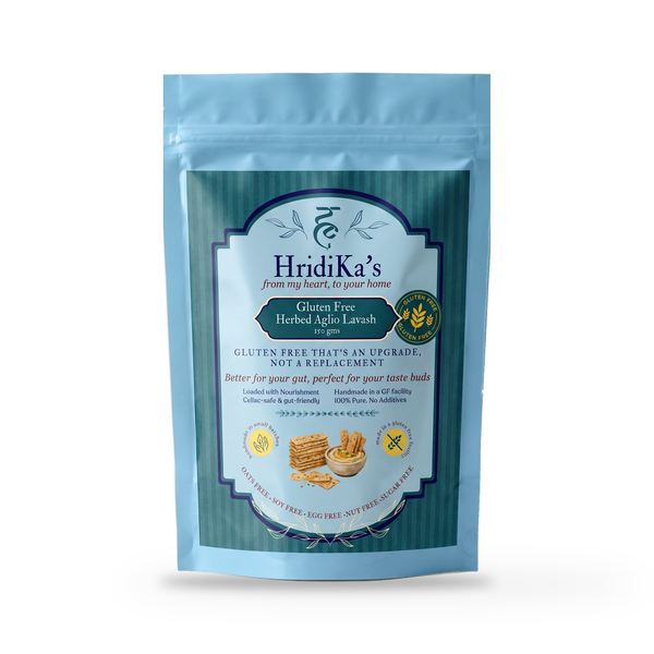 Front of the HridiKa's Gluten Free Herbed Aglio Lavash 150 g pack, a light blue stand-up pouch with a teal label, on a plain white studio background