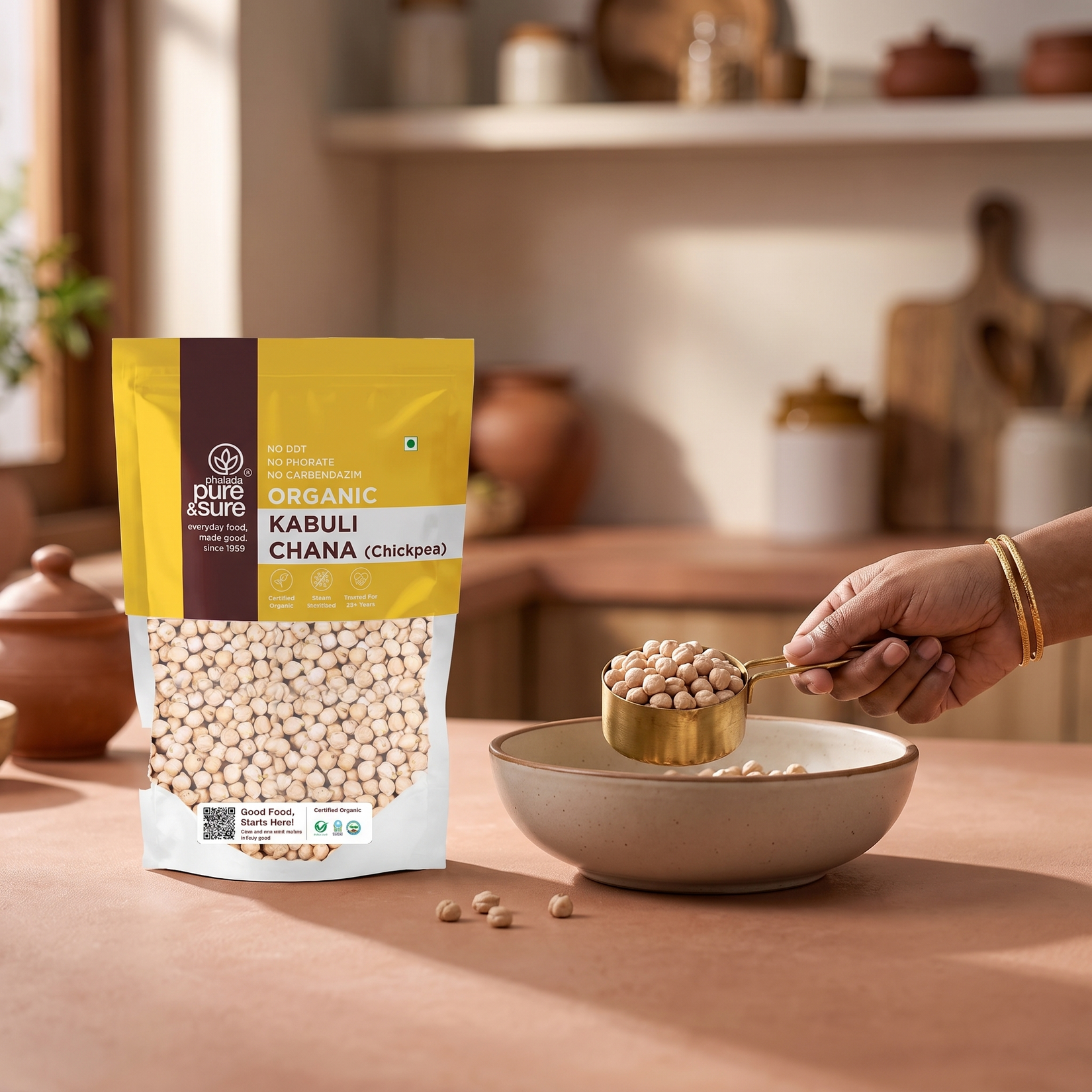 Scooping kabuli chana with a brass measure