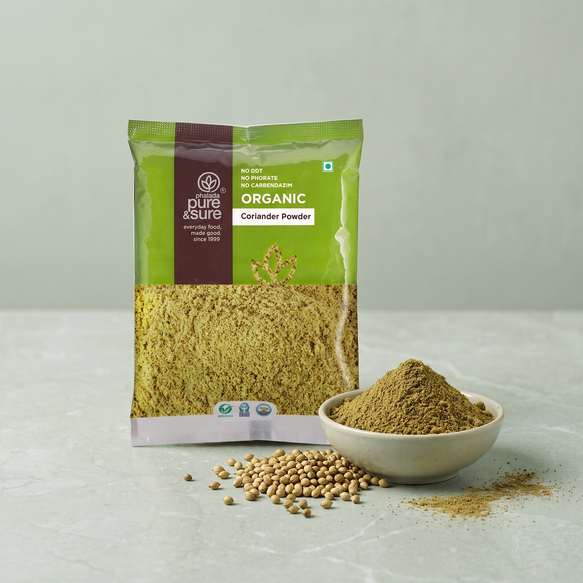 Pack with a bowl of coriander powder and whole coriander seeds