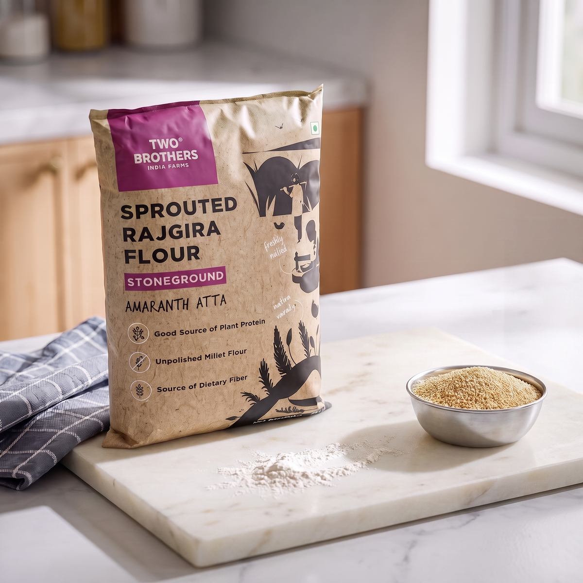 Sprouted rajgira atta pack on a kitchen counter beside a steel bowl of rajgira flour