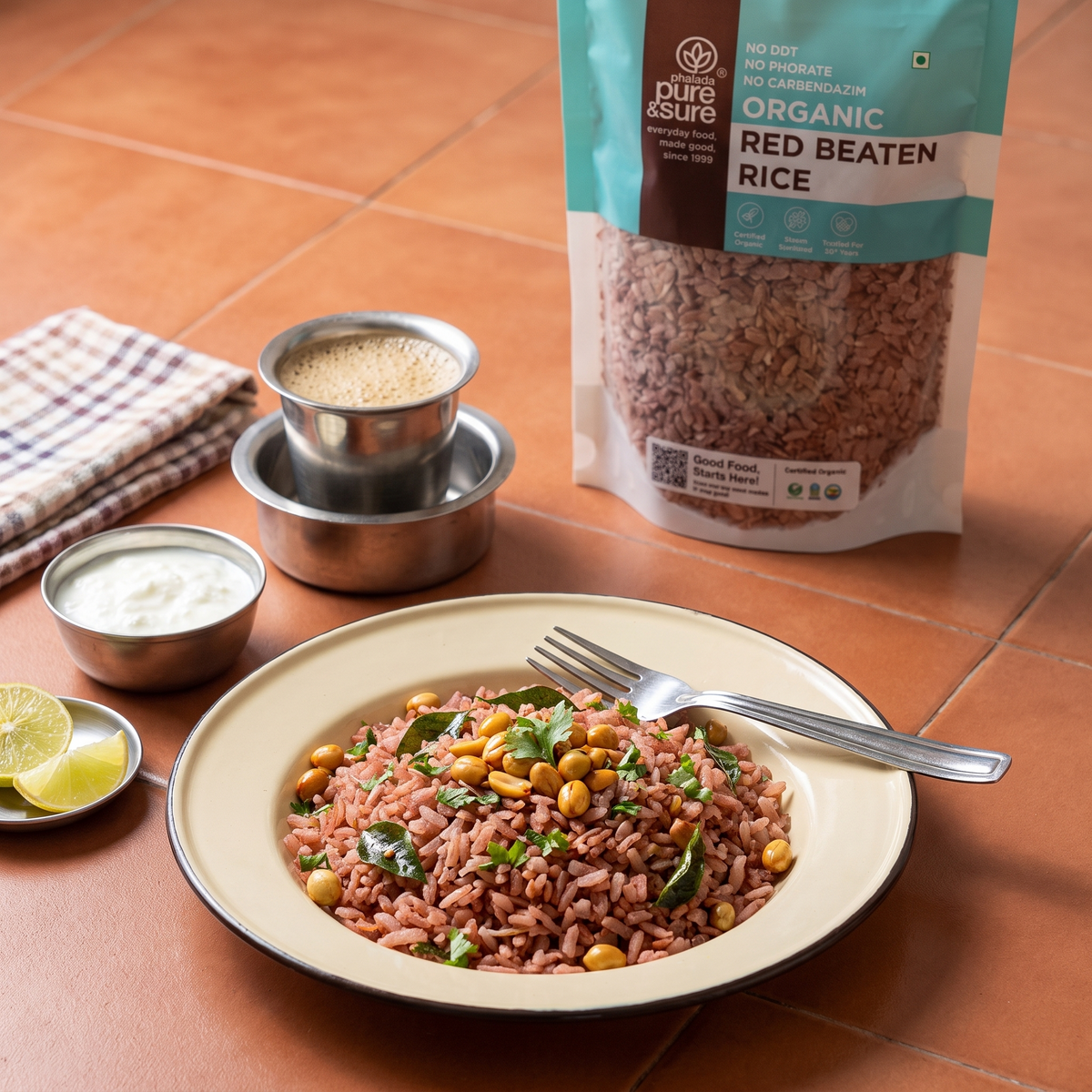 Red poha on a breakfast table with the pack