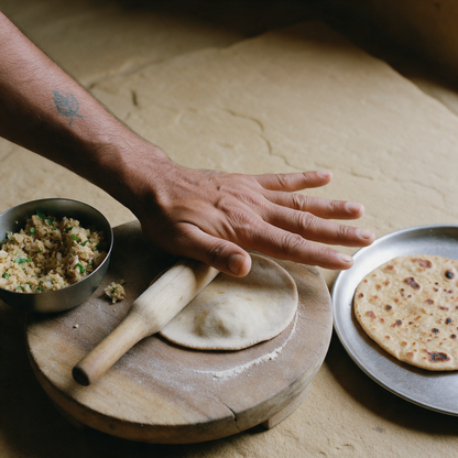 Rolling out a sattu-stuffed paratha