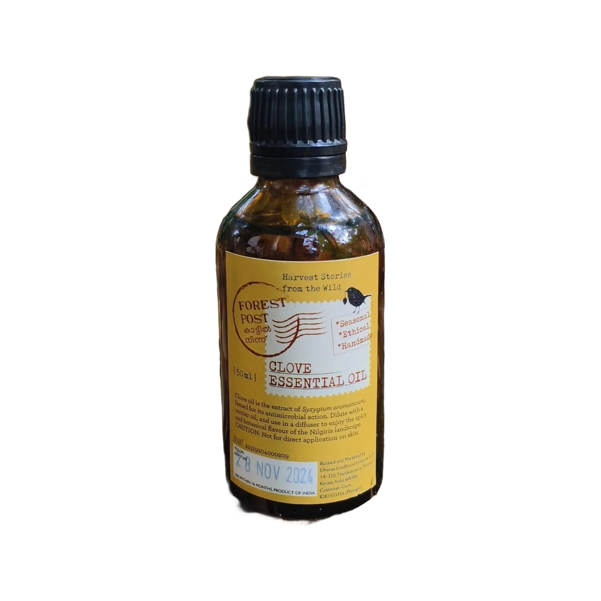 Forest Post Clove Essential Oil, amber bottle on a white background