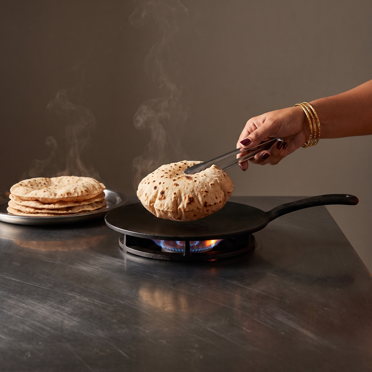 purepicked High Protein Khapli Atta roti being cooked on a hot skillet with a stack of fresh rotis on the side