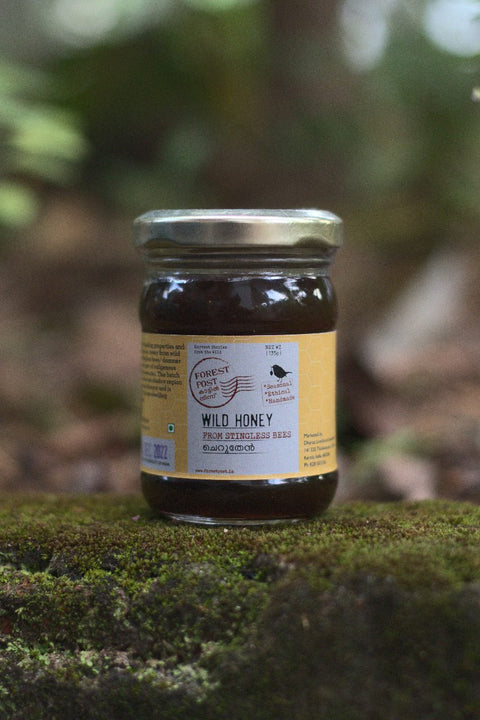 purepicked Wild Honey from stingless bees in a glass jar, harvested from the forests of Chinnar and Marayur.